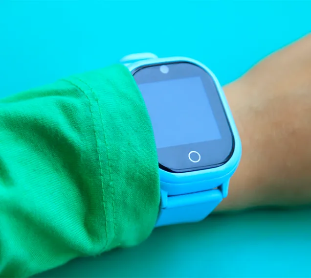 image of a child's wrist with a electronic watch