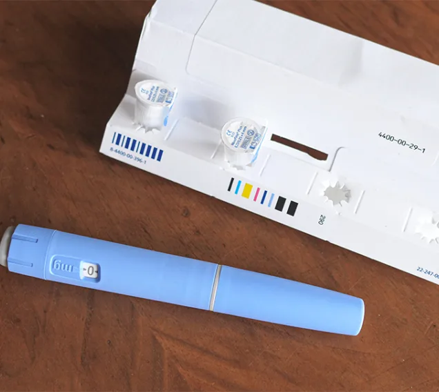image of an injectable diabetes/weight loss medication on a table next to it's box