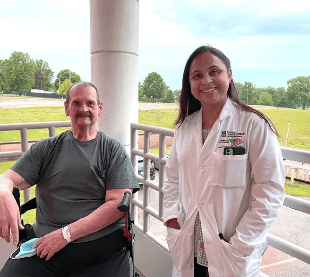 Image of Dr. Monu Khanna next to U.S. Army Veteran Michael Smith
