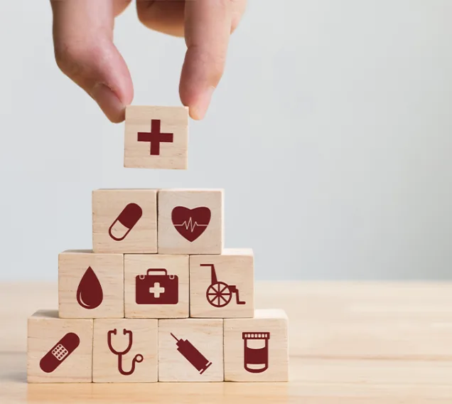 stack building blocks with medical icons on them