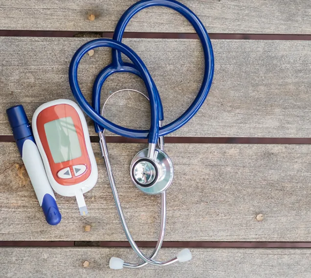 Image of a stethoscope and an insulin pen