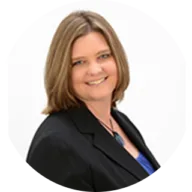 Headshot of Stephanie Orr, with short brown hair, wearing a black blazer with a white background