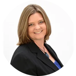 Headshot of Stephanie Orr, with short brown hair, wearing a black blazer with a white background