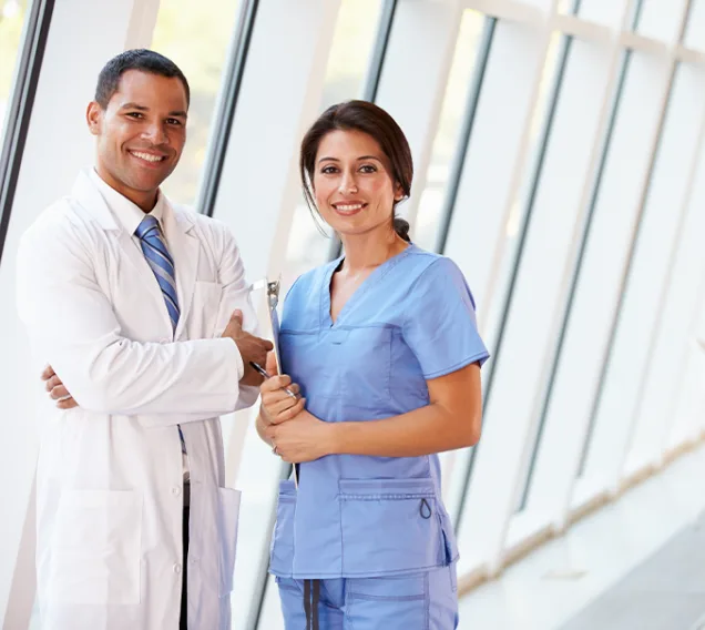 two doctors standing next to each other holding clipboards