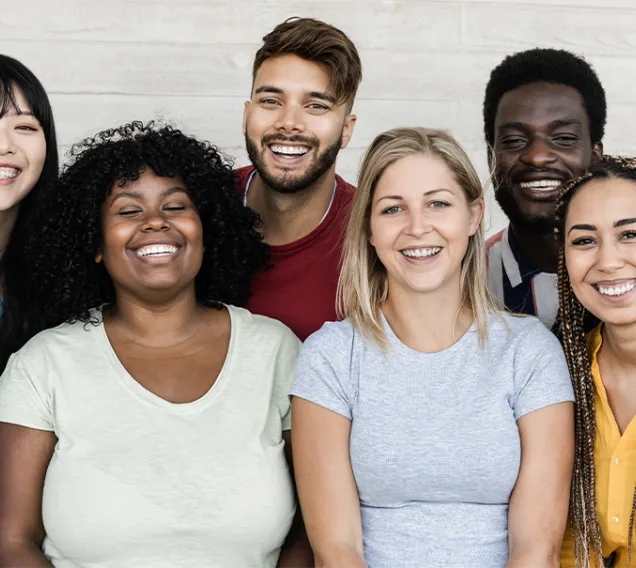 group of college-age students smiling