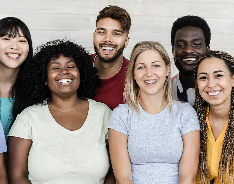 group of college-age students smiling