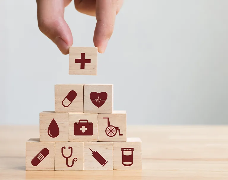 stack building blocks with medical icons on them