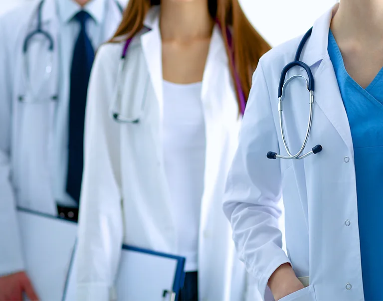 image of a group of 3 doctors standing in a row
