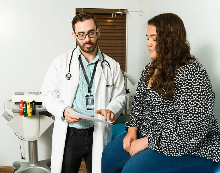 A doctor going over paperwork with a patient