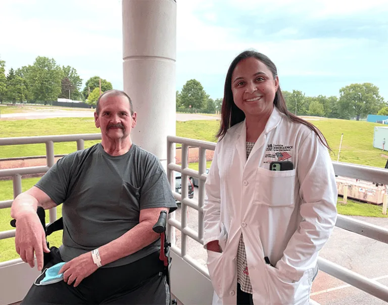 Image of Dr. Monu Khanna next to U.S. Army Veteran Michael Smith