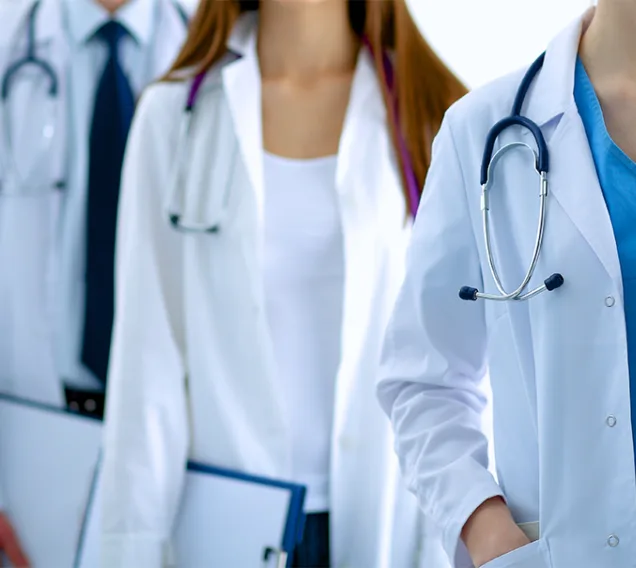 image of a group of 3 doctors standing in a row