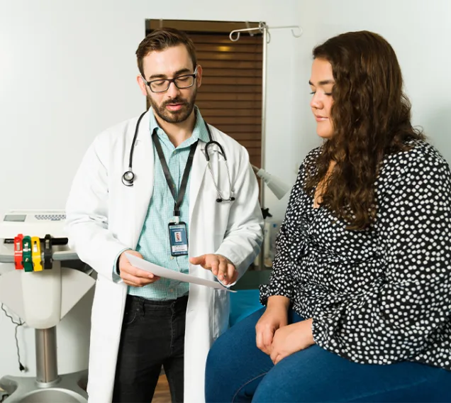 A doctor going over paperwork with a patient